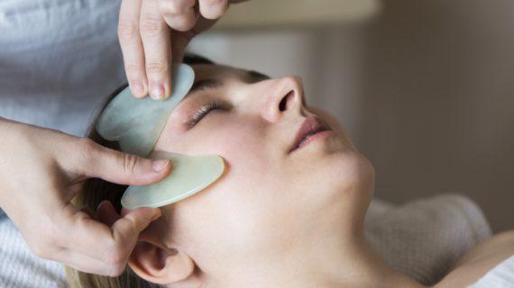 Young woman have face treatment at beauty clinic